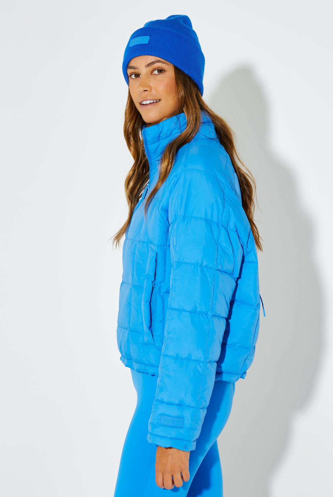 Woman Wearing Blue Bird Nellie Packable Puffer